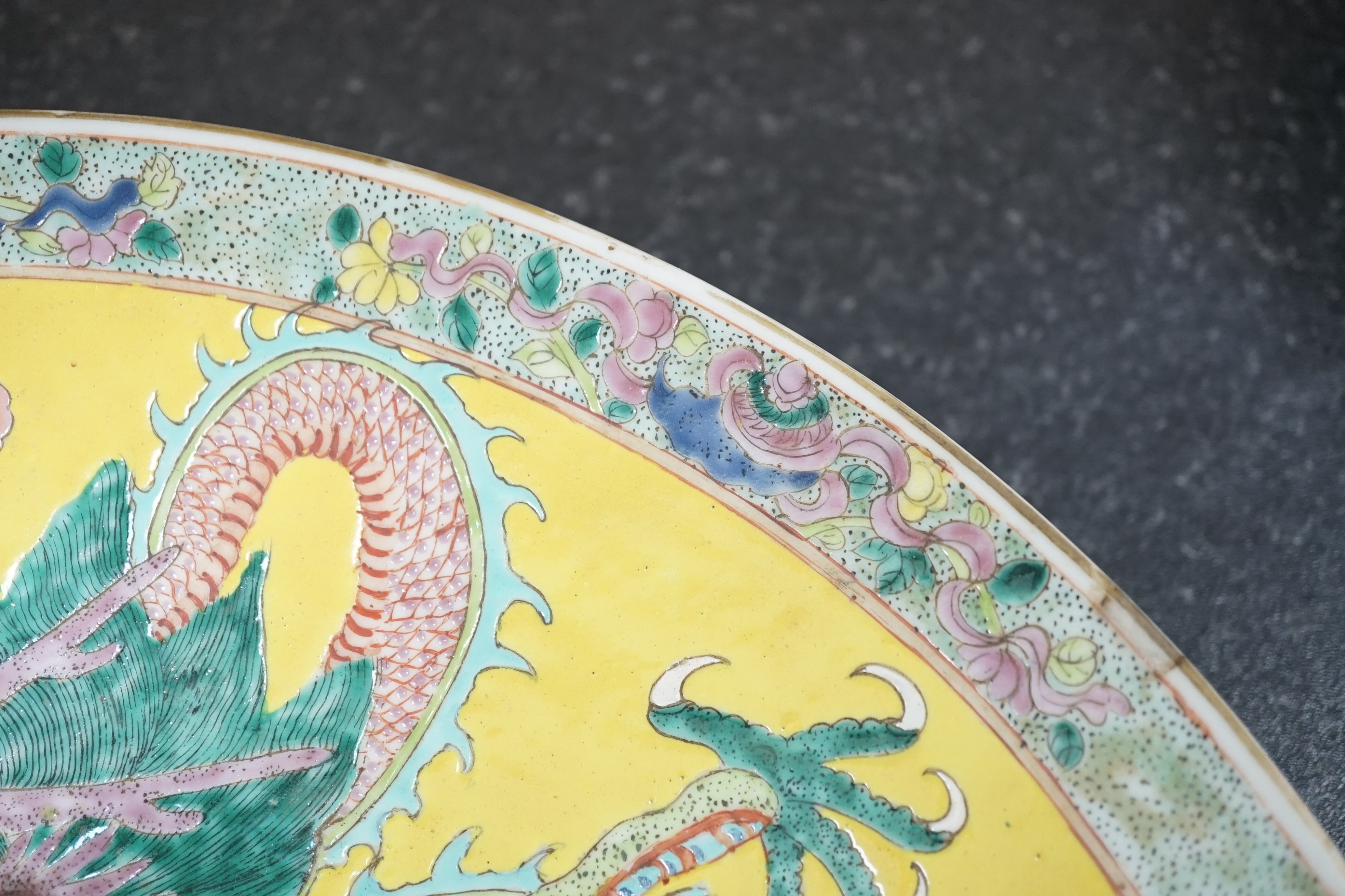 A Chinese yellow ground ‘dragon’ dish, late 19th century, minor damage